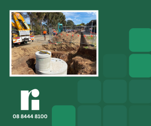 Image shows a Ri-Industries concrete underground rainwater tank being installed