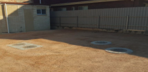 image shows cast iron covers flush to the ground